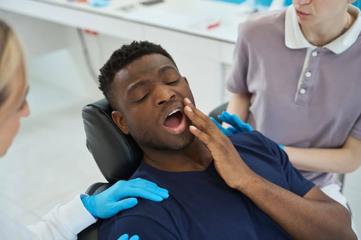 Emergency dentist in Ann Arbor providing urgent dental care to a patient with a toothache
