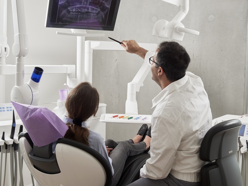 Patient smiling confidently after receiving dental implants at Comfort Smiles Ann Arbor