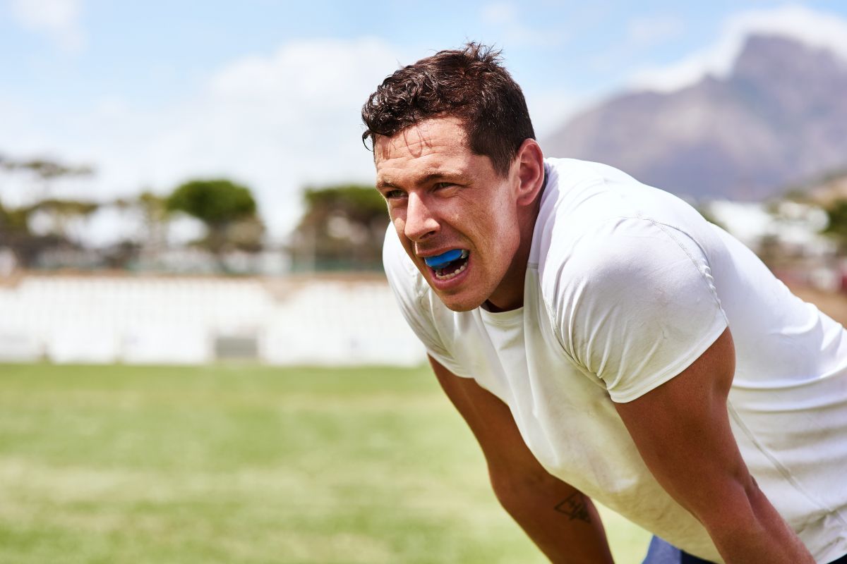 Athlete wearing a sports mouthguard to prevent dental injuries during physical activity